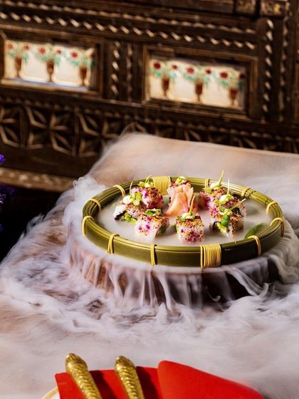 Our summer menu features light and refreshing dishes like this dramatic, smoky sushi platter, perfect for a midday culinary journey.