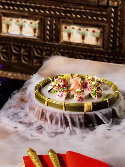 Our summer menu features light and refreshing dishes like this dramatic, smoky sushi platter, perfect for a midday culinary journey.