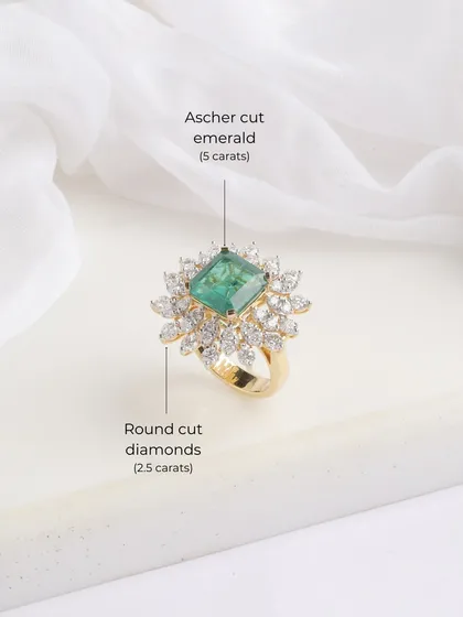 A close-up of the Heera Panna ring, detailing its 5-carat Ascher-cut emerald and the surrounding 2.5 carats of round-cut diamonds.