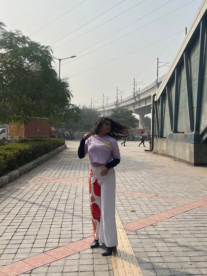 This is my take on abstract street style. I styled these custom-painted pants with a layered crop top for a casual, artistic look that’s perfect for a day out in the city.