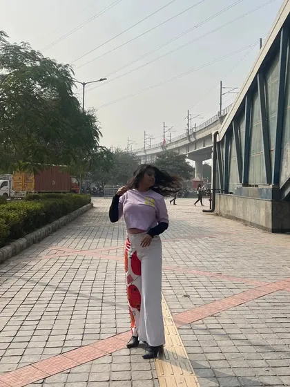 This is my take on abstract street style. I styled these custom-painted pants with a layered crop top for a casual, artistic look that’s perfect for a day out in the city.