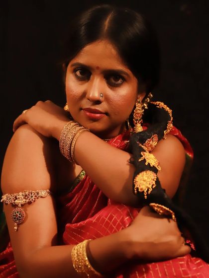 This shot highlights the traditional gold jewellery, arm cuff (bajuband), and the simple, elegant makeup of the vintage era.