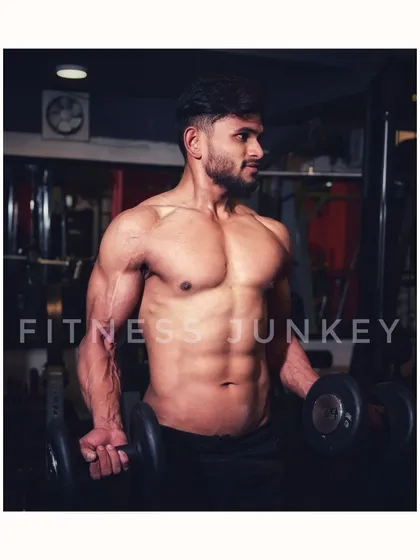 For fitness portfolios, I focus on definition and strength. Here, I used specific gym lighting to sculpt the muscles and capture the intensity of a workout, creating a powerful and motivating image for a fitness professional.