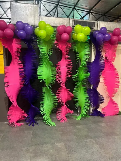 A vibrant and colorful fringe backdrop, perfect for photos at any party.
