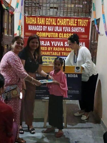 Another young student receiving her supplies. These small gestures can make a big difference in a child's educational journey.