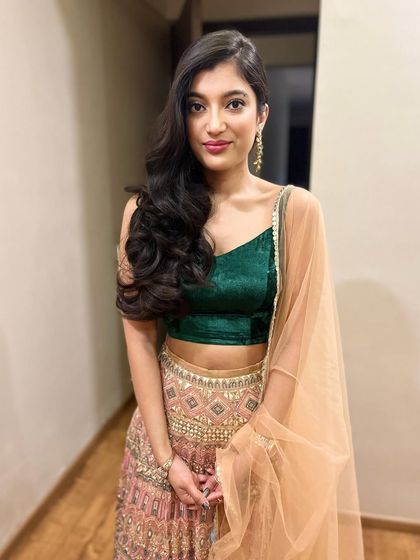My beautiful daughter. It's always a pleasure to do her makeup. For this look, we kept it simple and natural with soft waves, perfect for a family function.