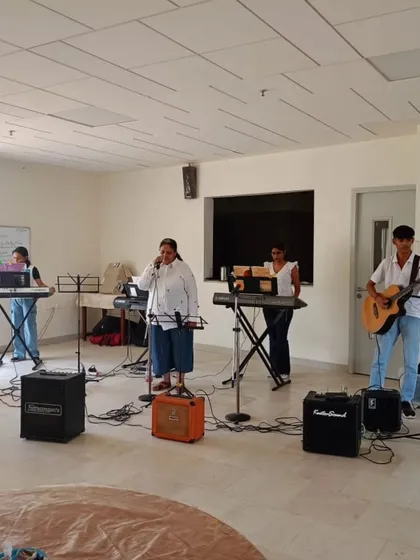 A full view of one of our student bands on stage, complete with keyboards, guitar, and vocalists. We provide all the necessary gear for a professional setup.