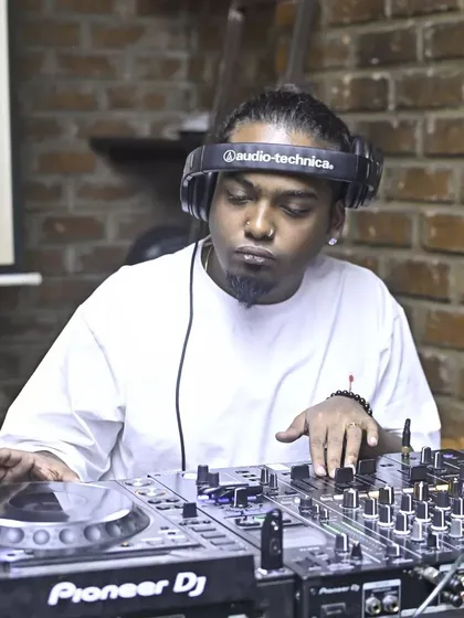 Locked in on the decks. This is the focus required to mix tracks seamlessly and keep the energy flowing.