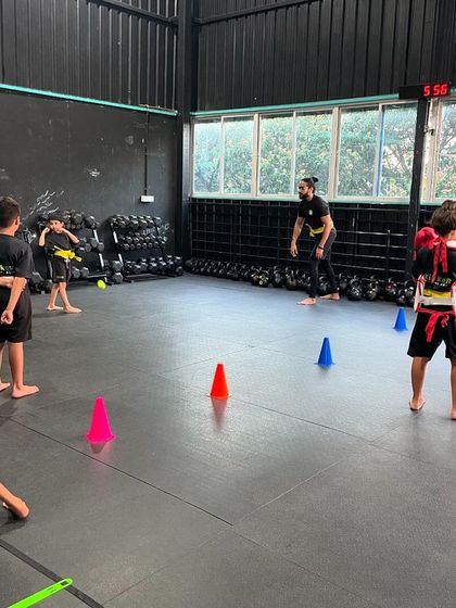 Happy Thursday. A shot of the class in session, with students engaged in various drills and activities.