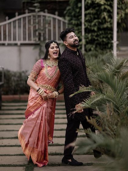 A playful, candid shot of the couple walking and laughing. This kind of unposed moment perfectly captures their personalities.