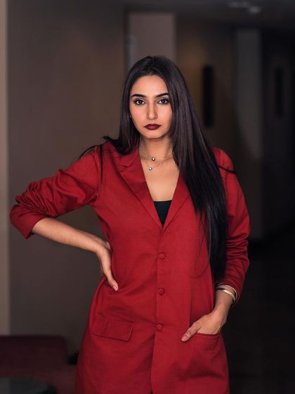 A powerful portrait of Ragini Dwivedi for her brand ambassadorship announcement. The red blazer and direct gaze convey confidence and professionalism, perfect for corporate and commercial campaigns.