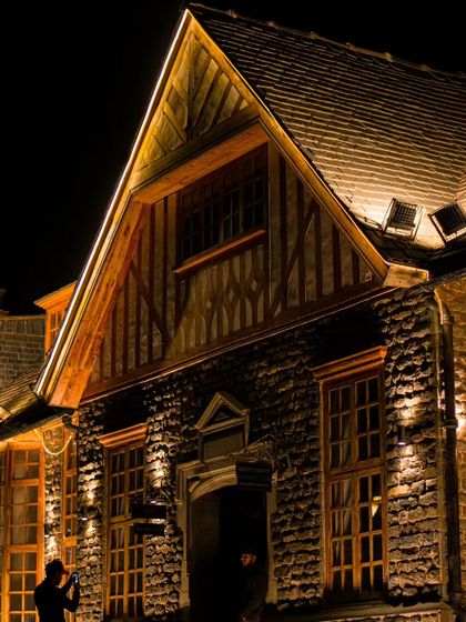 The beautiful, illuminated architecture of a building in Shimla at night.