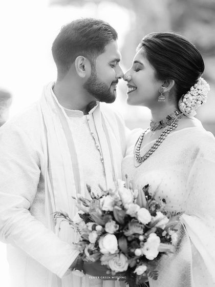 A classic black and white portrait, capturing the timeless romance and deep connection between the bride and groom.