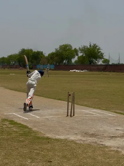 A batsman playing a shot during the match.