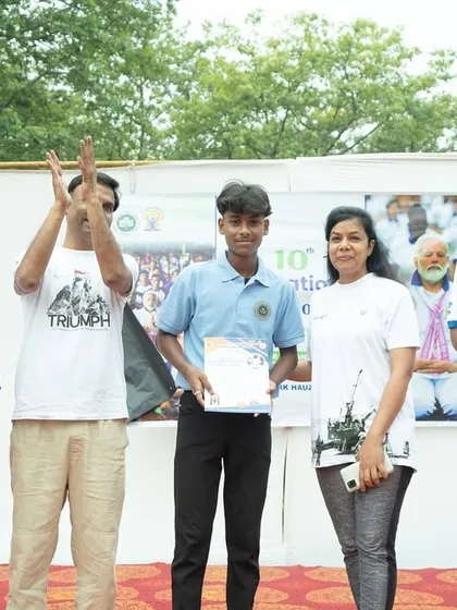 Celebrating the success of my male student as he receives his certificate of participation.