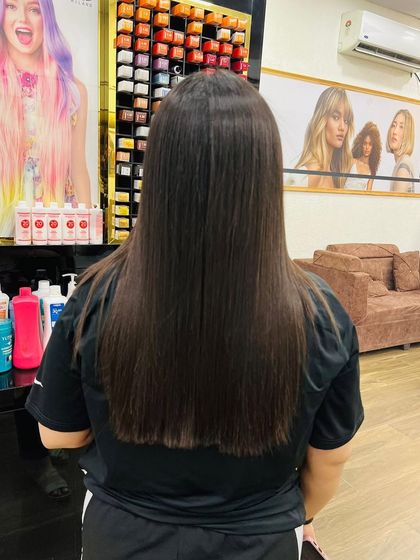 The final result of a hair treatment, leaving the client with straight, healthy-looking hair.