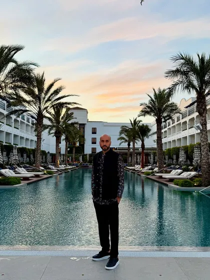 Sunset over the pool at a resort in Marbella, Spain. The views at these destination weddings are just as much a part of the experience as the music.