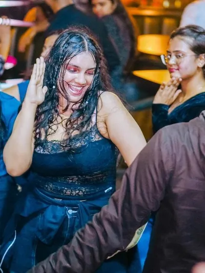 A candid shot of a guest dancing, completely lost in the moment.