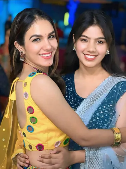 Posing with a friend during our Dandiya event. These celebrations are a great way for our community to bond.