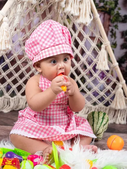 A little chef in her pink gingham outfit, tasting the ingredients. This is a wonderfully interactive and cute theme for curious toddlers.
