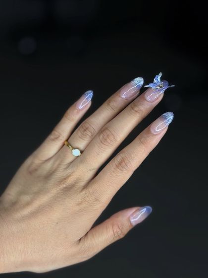 A clear, beautiful shot of the 4D ombre nails, showcasing the seamless gradient and the stunning butterfly accent.