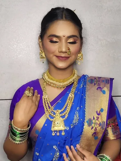 A serene portrait with eyes closed, showing the soft and blended eyeshadow work.