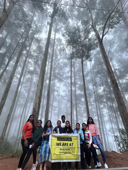 Another happy group in the misty pine forest of Kodaikanal.