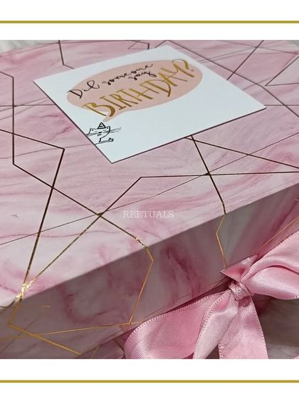 This magnetic gift box with a pink marble design and gold geometric lines is a gift in itself. It's sturdy, reusable, and so beautiful that it hardly needs any extra wrapping.