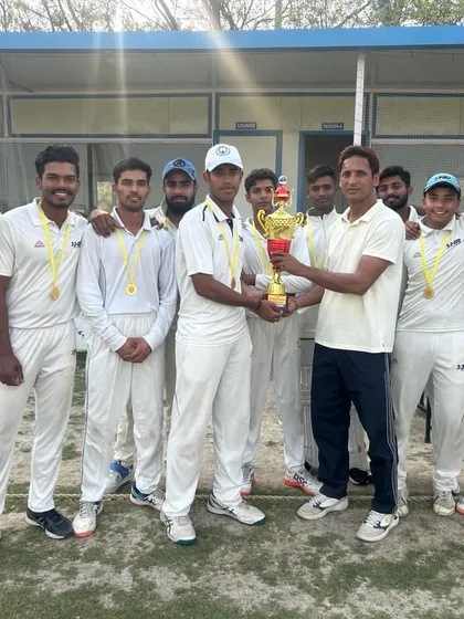 The team celebrating with the trophy after winning the final match. A moment of pure joy and accomplishment.