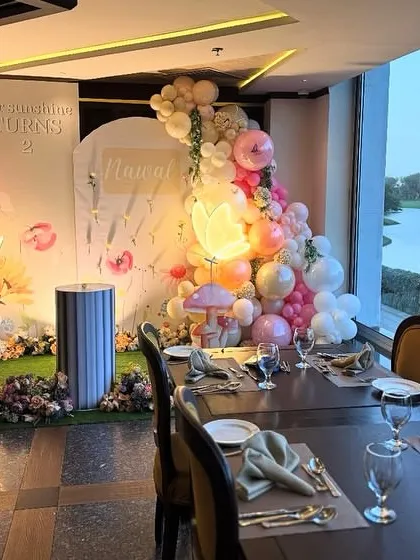 This setup looks even more magical with a scenic view. We designed this birthday decor for an intimate dinner setting overlooking a golf course.