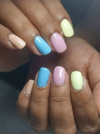 A softer take on the multi-color trend, using muted pastel shades of peach, blue, pink, and yellow. This is a great way to wear color in a more understated way.