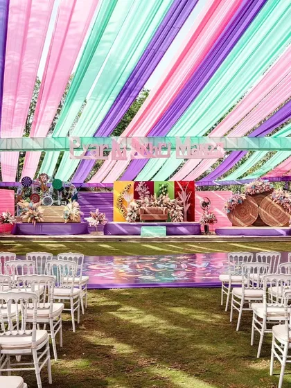 We love bringing creative themes to life, like this vibrant carnival-style Haldi. By using a bold color palette of purple, mint, and pink drapes and a custom-designed stage, we transformed a traditional ceremony into a high-energy, modern celebration.