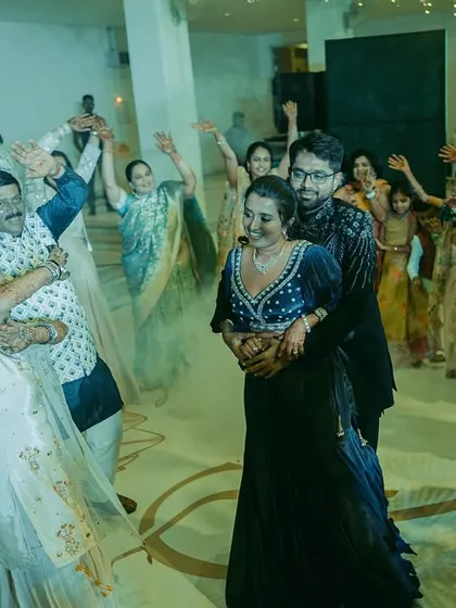 The energy of a Sangeet night is electric. Here, the couple and their families dance the night away, surrounded by friends and dramatic smoke effects that made for an unforgettable celebration.