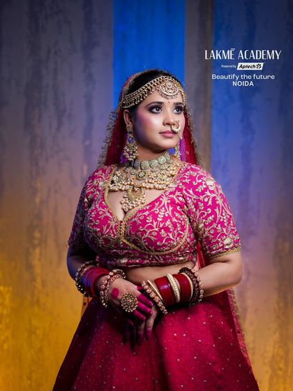 A stunning bridal look in a vibrant pink lehenga. Our students learn to create bold and beautiful looks that make a statement.