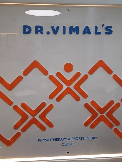 A close-up of our clinic's branding. The symbol of an active person is at the core of our mission to keep you moving and living a healthy, active life.