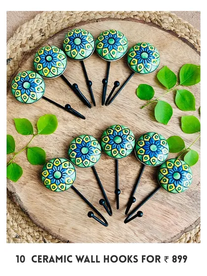 Our new mini ceramic wall hooks are here. This image shows a set of 10 in a beautiful green and blue design, perfect for adding a pop of color and functionality to your space.