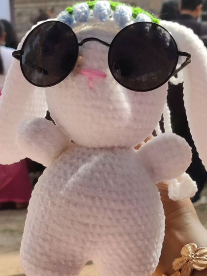 This bunny has serious "badass energy" with its flower crown and sunglasses.