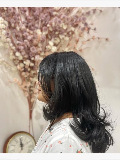 A side profile of the layered haircut, showing the beautiful shape and movement it gives to the hair.