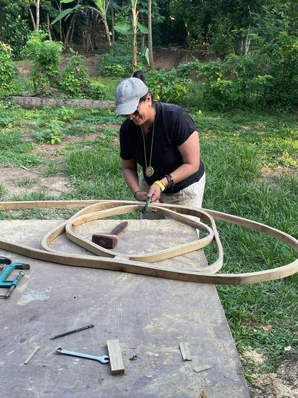 The process of creation is often about getting back to basics. Here, I am working on shaping wood for a new piece. The smell of sawdust and the feel of the material in my hands is where the real design happens.