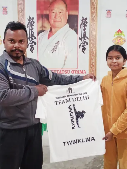 Twinklina with her new team t-shirt. She is excited and prepared for the competition.
