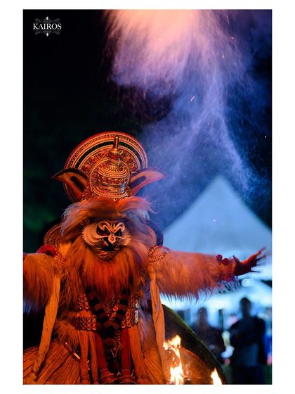 A performer surrounded by smoke and fire, creating a mystical and powerful image that showcases my ability to capture dramatic event moments.
