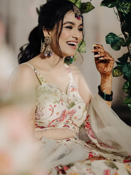 A candid shot of the bride's infectious laughter.