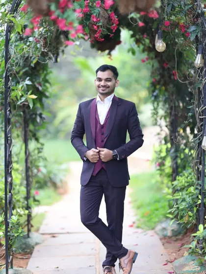 Look sharp and polished for any event with my collection of men's suits for rent. This classic three piece suit in a deep wine color is perfect for weddings, corporate events, or a sophisticated pre-wedding photoshoot.