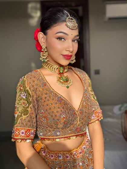 A close-up of this bold look, featuring a sharp winged liner and a classic red lip.