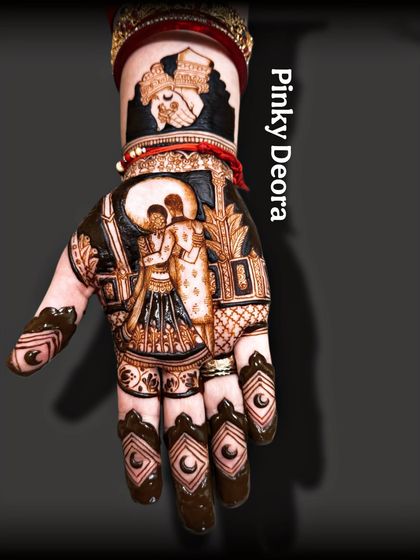 Another angle of the completed Karwa Chauth design, showcasing the intricate patterns on the fingers.