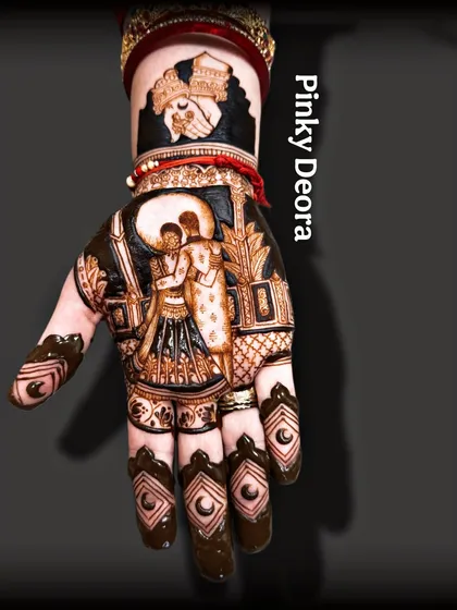 Another angle of the completed Karwa Chauth design, showcasing the intricate patterns on the fingers.