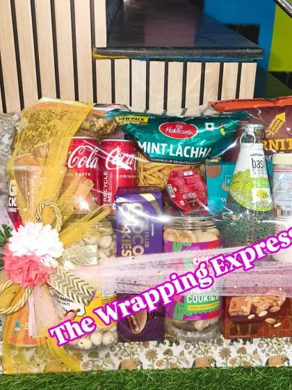 Sometimes a simple basket of goodies is the perfect gift. I put together this hamper with a variety of popular snacks, cookies, drinks, and sweets, all neatly wrapped and ready to be enjoyed.