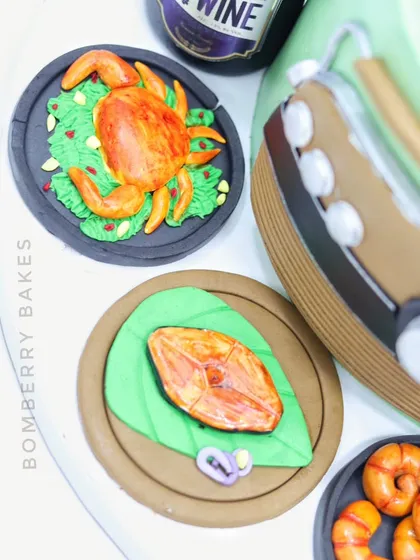 A close-up of the edible crab and fried fish on banana leaf.