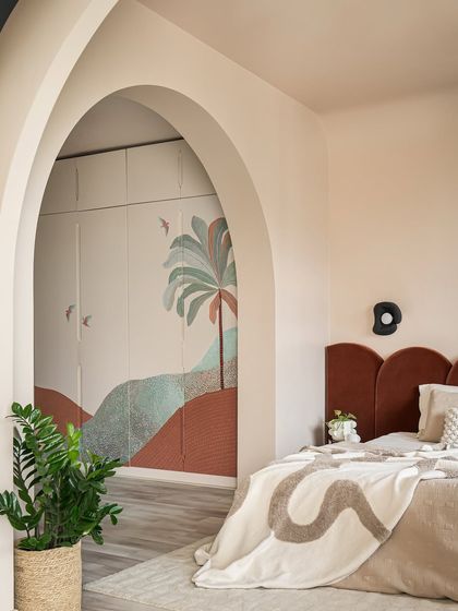 The wardrobe shutters in this bedroom feature a dreamy landscape hand-painted by our client. This personal touch makes the space truly unique and a reflection of her own creativity.