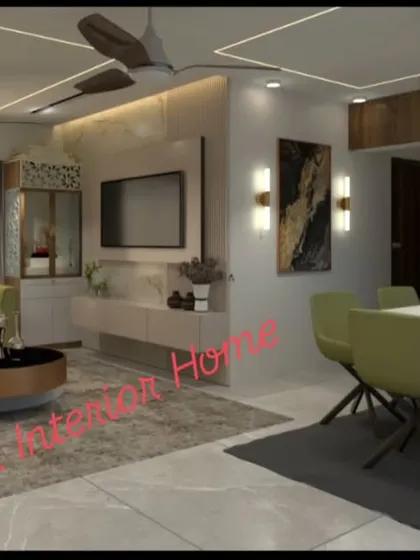 Another perspective of the green-themed living room, showing the TV unit against a marble-finish wall. The layout is designed for both relaxation and entertainment.